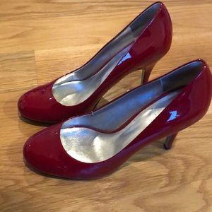 Red patent leather pumps